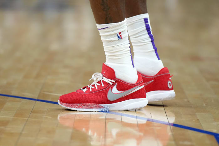 View of LeBron James' red and white Nike shoes.